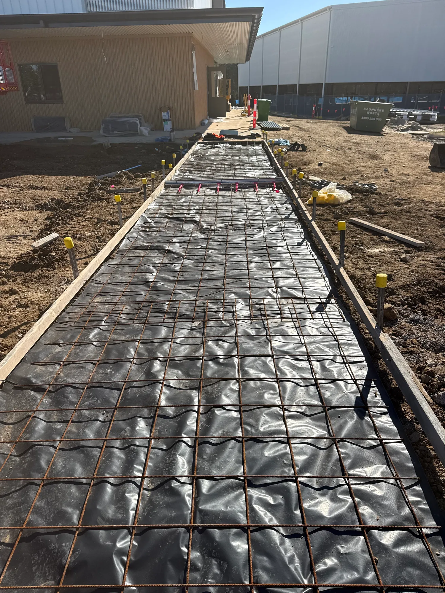 Reinforced concrete driveway prepared for pouring